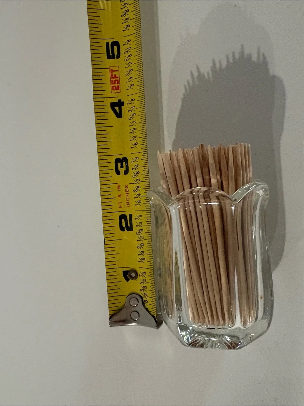 Vintage clear pressed glass toothpick holder w/ a paneled body & scalloped rim